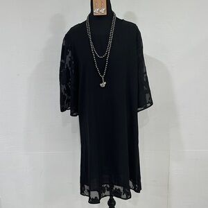 Elegant Black Dress with Sheer Sleeves